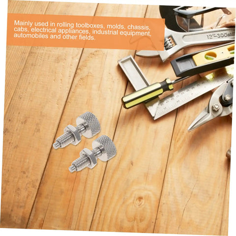 Two Piece Stainless Steel Retractable Spring Loaded Indexing Plunger Lock For Rolling Toolboxes on wooden surface with tools.