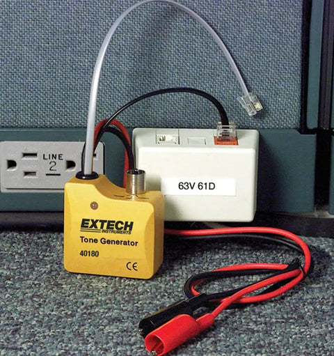 Heavy Duty Wire Tracer And Cable Tester Kit with alligator clips, RJ45 connector, and tone generator on a floor carpet.