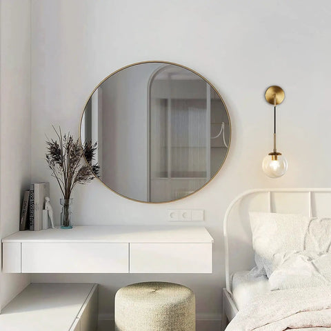 Mid Century Modern Wall Light With Adjustable Cord Raw Brass Round Glass Sconce And Amber Lampshade next to bed