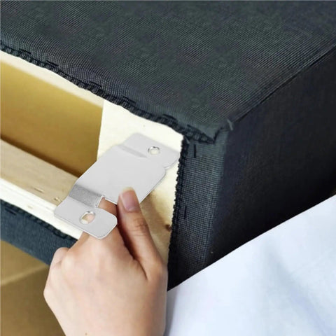 Close-up of heavy gauge snap lock connector being installed on sectional sofa for reinforcement.