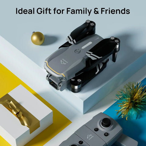 Folded Dope 4K UHD Drone With Camera For Adults And Kids on table, next to gift boxes and remote, showcasing portability.