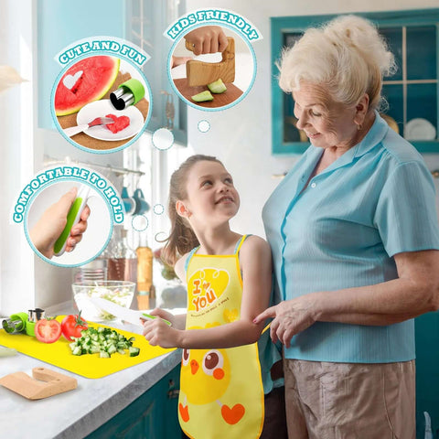 Montessori kids kitchen tools set on a yellow cutting mat; child in apron uses a plastic toddler knife to cut vegetables.