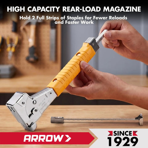 Person holding Heavy Duty Hammer Tacker With Sure Grip Handle Pro Grade Manual Stapler Dual Load Rear Magazine on workbench.
