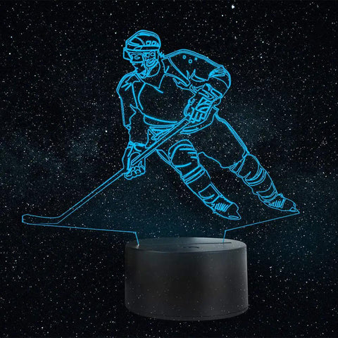 Hockey Player 3D Night Lamp With 7 LED Color Changing Lights on black base, blue hockey player illusion in starry background.
