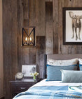 Four Light Wood Grain Black Cage Pendant Lamp in a rustic farmhouse style bedroom setting