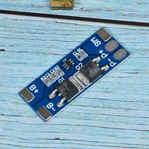 No Fuss 2 Pack 2S BMS For 18650 Lithium Cells 7 4V Balanced Charging Guard circuit board with connectors on a wooden table.