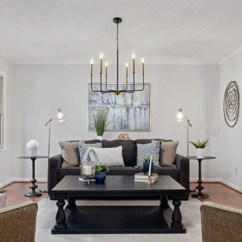 Black And Gold Modern Farmhouse 6 Light Chandelier With Rustic Industrial Metal Design for Dining Room Living Room Entryway And Kitchen Height Adjustable Ceiling Light Fixture above black table in living room.