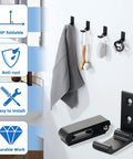 Built Different Matte Black Wall Mount Towel And Coat Hooks, Heavy Duty Aluminum Alloy with grey towel and bath accessories on wall.