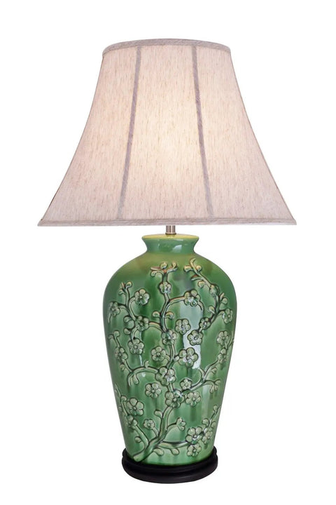 Green Glaze Floral Embossed Ceramic Table Lamp With Dark Wood Base, Traditional 33.5 Inch Height, Oval Bell Off White Linen Shade Measuring 20 Inch Wide By 11 Inch, Medium Base Bulb Up To 100 Watts, Soft Ambient Glow For Living Room.