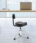 Solid As A Rock Drum Throne Stool With Plush Memory Foam Backrest in modern workspace setting with adjustable height.