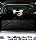Person holding bag for 10x20 Pop Up Canopy Tent With Mosquito Netting in car trunk, Easy Setup