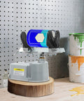 Solid As A Rock Air Operated Paint Shaker Heavy Duty Adjustable Clamp Agitator Mixer with paint cans on workbench.