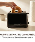 Top Shelf 2 Slice Toaster Features Cool Touch Exterior And Massive 1 25 Inch Slots That Handle Big Bagels And Waffles Like Butter With Six Shade Levers For Crispy Golden Results That Hit Different Every Day A Smooth Operator For Your Kitchen Counter, compact black design toasting bagel.