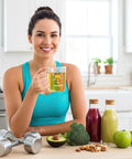 Woman holding Two Pack Beaker Mugs With Handles, 16 Oz Caffeine Molecule Glass Coffee Cups in a kitchen with healthy foods.
