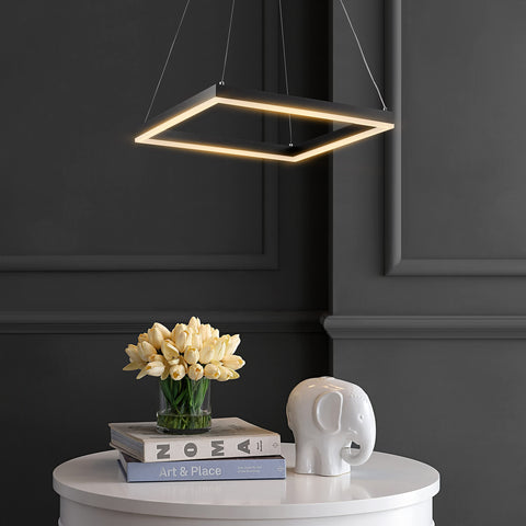 Black 15.75 Inch Modern Square Integrated LED Pendant Light Fixture, illuminated over a table with tulips and decor in a minimal room.