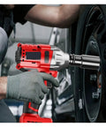 Gangsuqd Brushless Cordless Impact Wrench with high torque in use on a car tire for heavy duty repair work.
