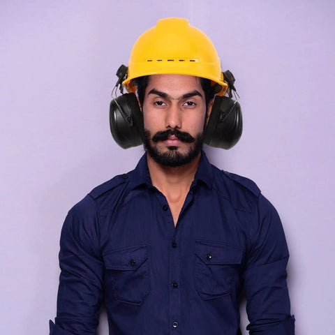 Beefed Up Heavy Duty Safety Hard Hat Earmuffs With Zero Hassle Adjustable Fit And Deep Noise Cancelling Seals For Crews Knocking Out Loud Job Site Projects worn with a yellow hard hat.