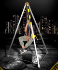 Built Tough Confined Space Tripod Rescue Winch Rig With Heavy Duty Stabilizer Hoist And Full Body Fall Arrest Harness Kit For Tunnel Sewer Construction Lifting And Battle Ready Lifesaving Protection At 1800 Lbs, with user suspended above manhole.