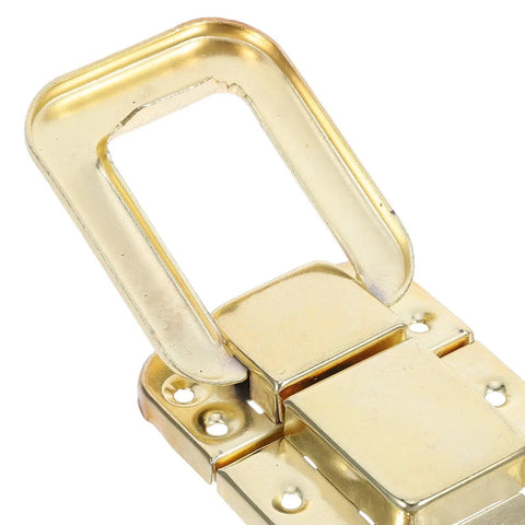 Close-up of a Retro Vintage Toggle Hasp Latch, antique yellow metal, ideal for wooden trunks and storage furniture.