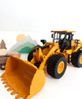 9-Channel Remote Control Wheel Loader 1:18 Scale Construction Toy with realistic sounds and lights on white background with toy blocks.