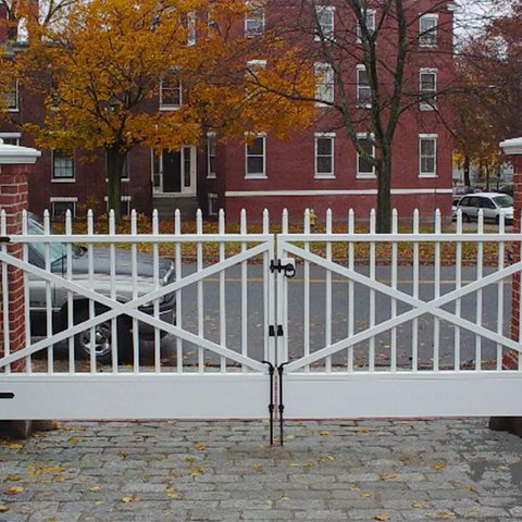 White double gate with 18 Inch Drop Cane Bolt Gate Latch, beefy heavy duty black solid steel ground drop rod securing the gate.