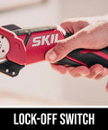Hand holding 12V Compact Multi Cutter Tool Only With Self Sharpening Blade One Quarter Inch Cutting Capacity For Cardboard Carpet Leather And Vinyl Lightweight Ergonomic Grip Lock Off Safety Battery And Charger Not Included