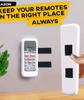 Heavy Duty Hook And Loop Tape Roll With Super Sticky Adhesive Backing Badass Industrial Fastening Strips That Cling Like Crazy And Rip Clean In Black One Inch securing a remote on a wall.
