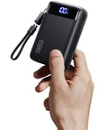 Ultra Compact 20000mAh Power Bank Featuring Dual USB Cables And Secure Lanyard Offers Beast Mode 22.5W Fast Charging held in hand.