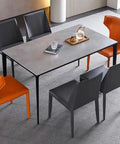 Hella Sturdy Heavy Duty Metal Desk Legs Leveling Up Your Space With Sleek Industrial Vibes Perfect For DIY Coffee Tables And Office Desks Today, with a gray table and contrasting orange and black chairs.