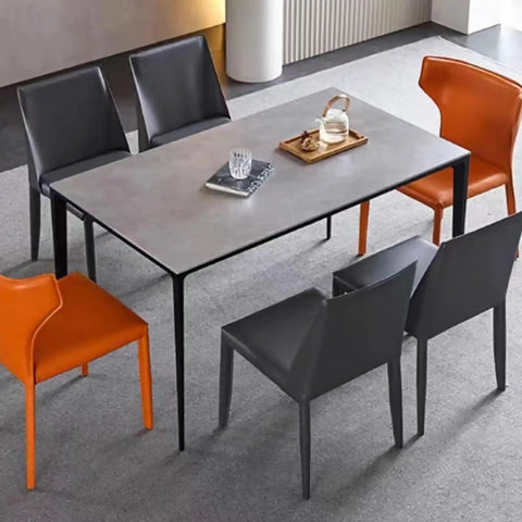 Hella Sturdy Heavy Duty Metal Desk Legs Leveling Up Your Space With Sleek Industrial Vibes Perfect For DIY Coffee Tables And Office Desks Today, with a gray table and contrasting orange and black chairs.