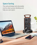 Vertical Power Strip Tower With 10 Outlets And 4 USB Ports, Retractable 6.5ft Cord, Wood Grain Desk Charger beside laptop