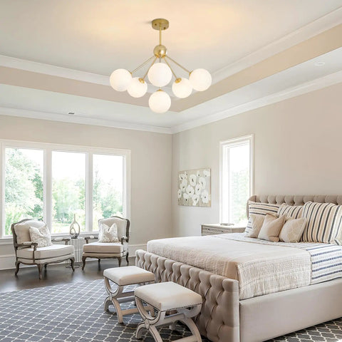 Six Light Frosted White Glass Globe Sputnik Chandelier in Modern Gold Finish hanging in a contemporary bedroom ceiling.