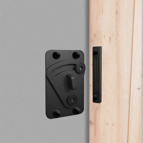 No Sweat Black Carbon Steel Sliding Barn Door Latch Lock With Slick Powder Coated Finish mounted on a grey wall.