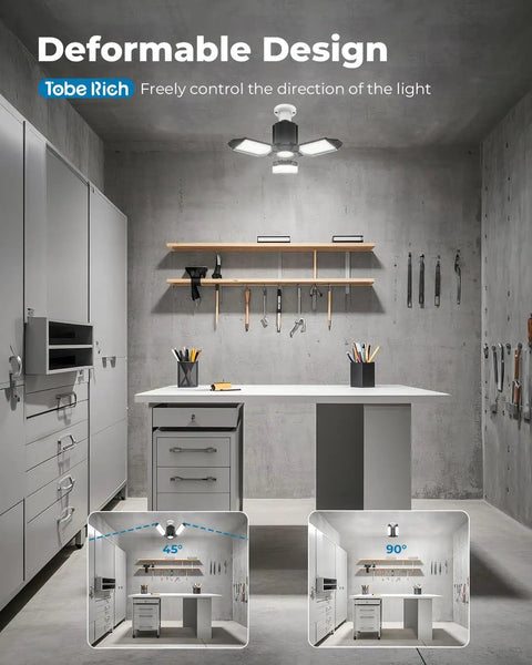 Two Pack LED Garage Lights 8000LM With 3 Plus 1 Deformable Panels 6500K Daylight Ceiling Bulbs installed in modern workshop.