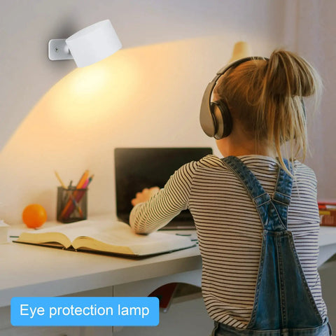 Child studying under Cordless Rechargeable LED Wall Sconces 2 Pack With Magnetic Touch Dimmer And Remote 360 Degree Rotating Wall Lights