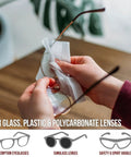 Person using Premoistened Eyeglass Wipes For Glasses Phones Lenses And Screens Quick Dry Scratch Free Cleaning Wipes Individually Wrapped 200 Count Pack For Easy On The Go Care on eyeglasses