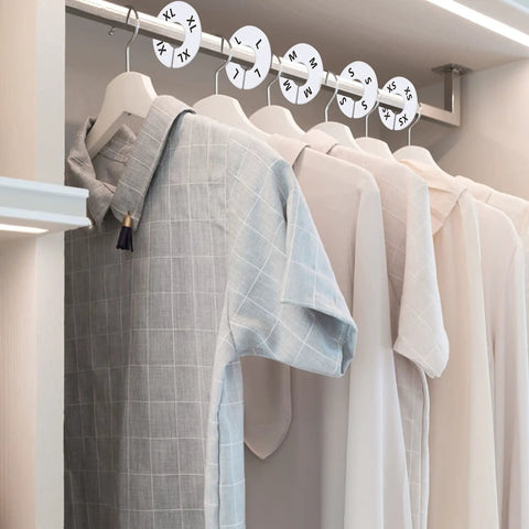 40 Pack Round White Plastic Closet Rack Dividers Preprinted With 8 Sizes XXS To XXXL For Easy Organization shown in closet setting