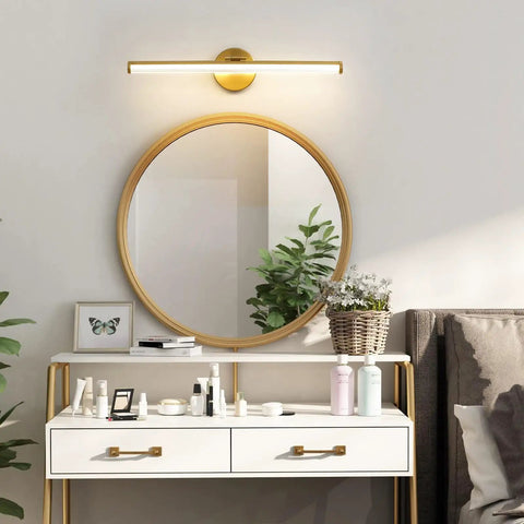 Gold Vanity Light Bar Over Mirror, 22 Inch LED Dimmable Fixture above round mirror on elegant white dresser with decor.