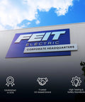 Building facade with 'Feit Electric Corporate Headquarters' sign, blue sky and clouds overhead.