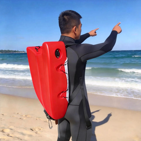 Person on beach carrying Spearfishing Float Boat With Carry Straps Foldable Flagpole And Compact Storage Red Buoy