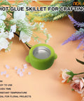 Compact Portable 2.5 Inch Mini Electric Hot Glue Pot 35W Fast Heating Up To 380 Fahrenheit For On The Go Small Crafts Beads Floral Arrangements Wreaths Wax Pellets Sticks Dipping Stems And More on a floral background.