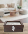 Wooden box with Vintage Metal Toolbox Lock Hasp Latch Set on table, small cabinet lock for jewelry boxes, retro style.