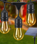 Solar Outdoor String Lights 39 Feet With 16 Hanging Edison Plastic S14 Bulbs, shatterproof LED bulbs and solar panel in garden