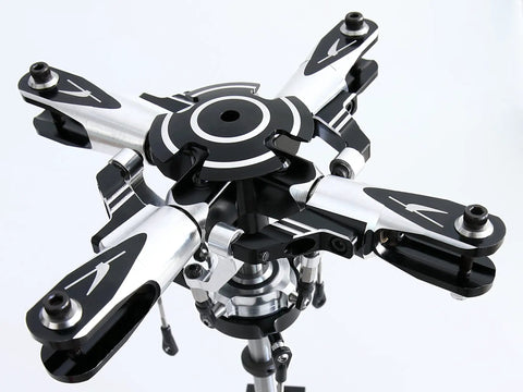 Close-up of T Rex 600 DFC 4 Blade Flybarless Rotor Head Kit for Trex 600 RC Helicopter, CNC machined alloy parts, top view.