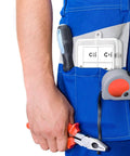 Person in blue overalls holding pliers, with a 580 Piece Black Alloy Steel E Clip Set With 10 Size Assortment M1.5 To M10 Kit in pocket.