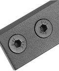 Close-up view of a black rectangular Barn Door Track Connector Set Black Flat Mending Repair Plate For Barn Door Hardware And Sliding Doors