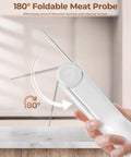 2-In-1 Infrared Thermometer Gun With Meat Probe Handy Digital Laser Temp Meter showing foldable probe feature on wood surface