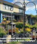 Two Pack Outdoor Hanging Bird Feeders With Quick One Minute Setup And Charming Castle Design Attracting Cardinals Chickadees Goldfinches And Sparrows Black Easy To Assemble For Family Fun And A Great Gift shown hanging with birds feeding