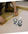 Stainless Steel Double Bearing Sliding Door Caster Wheel Kit For Ultra Smooth Rolling on a wooden surface with measuring tape