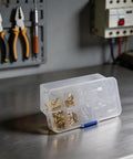 Kick-Start Your Electrical Projects With This Awesome Female Spade Terminal Kit Featuring Reliable Copper Connectors In 2.8mm 4.8mm And 6.3mm Sizes Plus Insulation Sleeves Perfect For AWG 18-14 Wire Auto And Audio Gear That Really Pops. clear box of copper female spade terminals in workshop